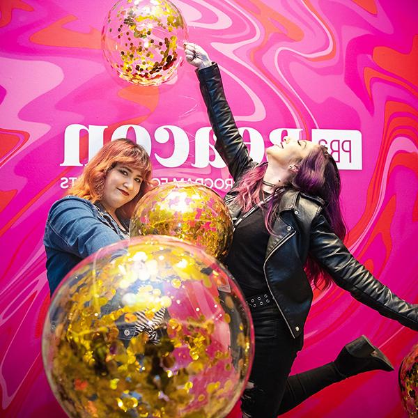 http://u62l.lfkgw.com/wp-content/uploads/2023/06/two-women-holding-balloons-in-front-of-a-pink-pba-beacon-wall.jpg